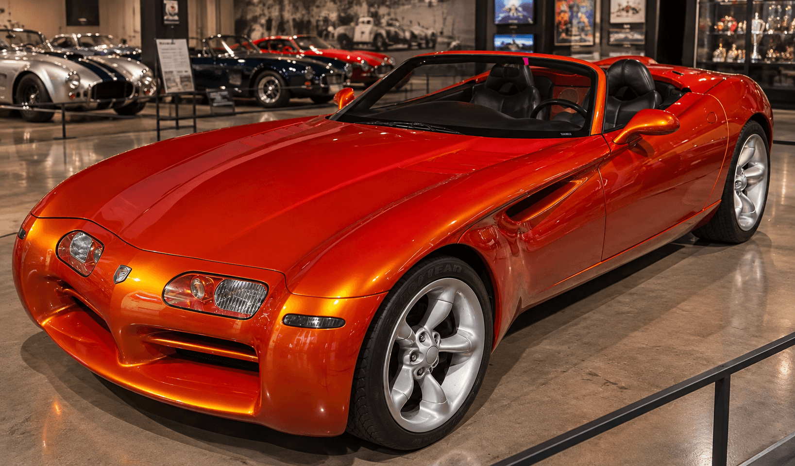 Orange roadster identified by the owner as the 1997 Dodge Copperhead concept, displayed indoors.