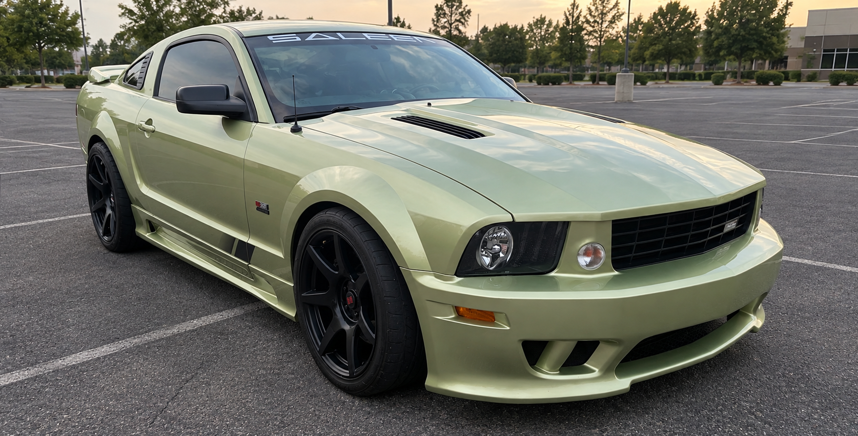 Legend Lime 2005 Saleen S281 Supercharged Mustang viewed from the front three-quarter angle in a parking lot.