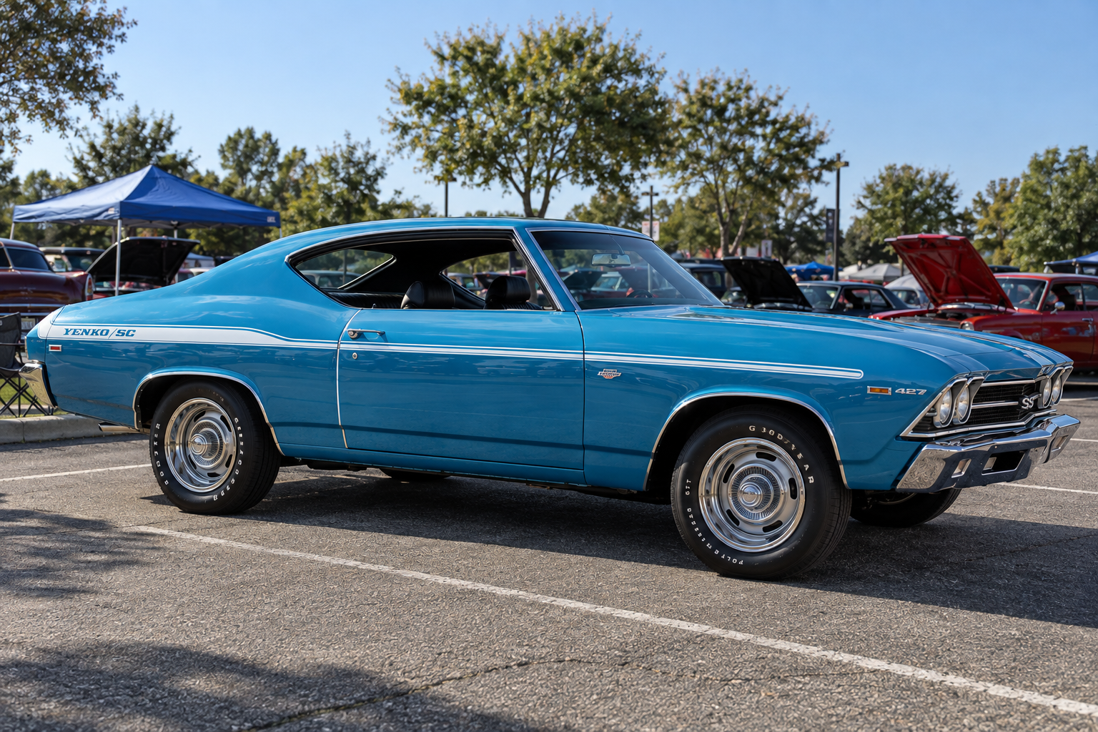 Blue 1969 Chevelle with Yenko/SC side striping, photographed from the side at a car show.