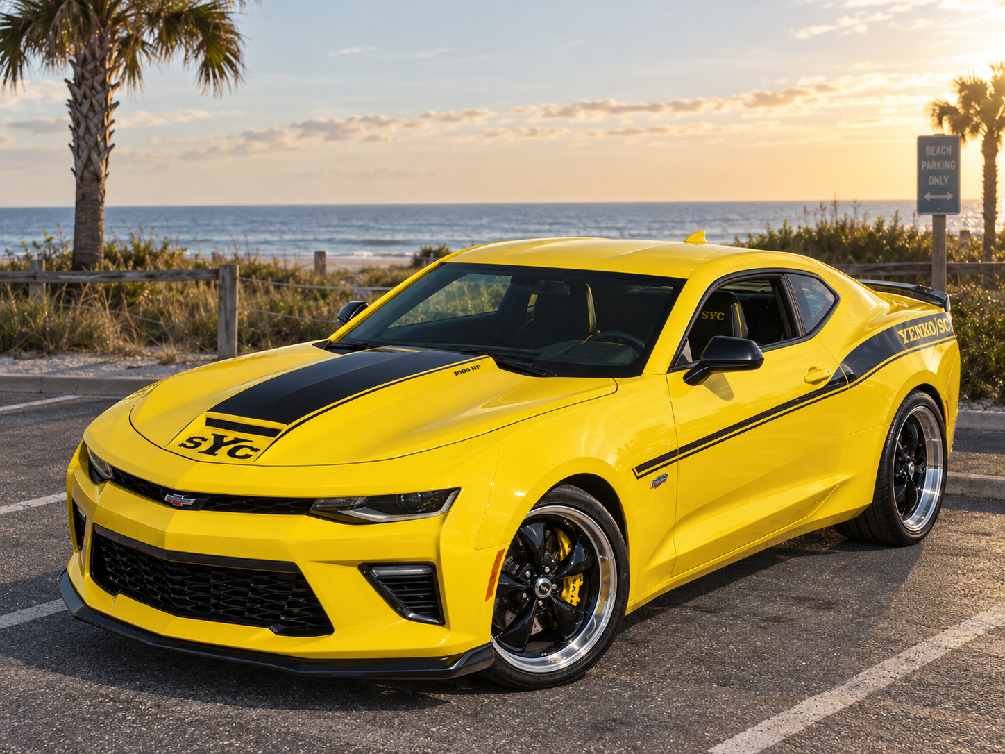 Yellow modern Chevrolet Camaro with black Yenko/SC striping and hood graphics, photographed from the front three-quarter angle.